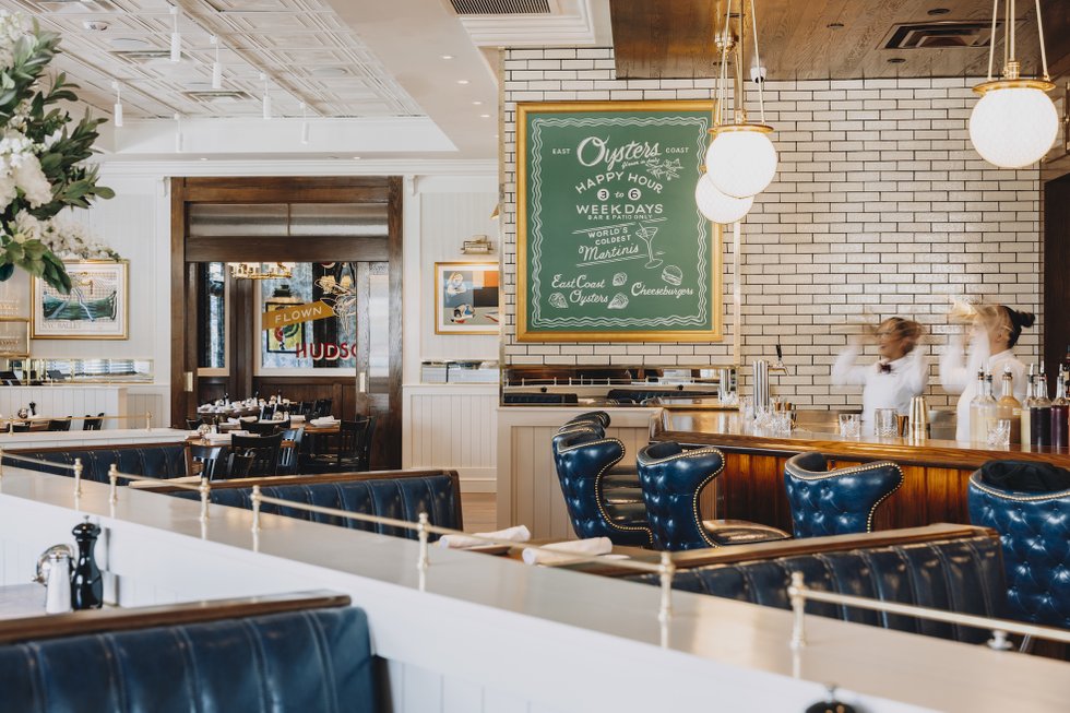 Blue leather booths and oyster bar inside Hudson House
